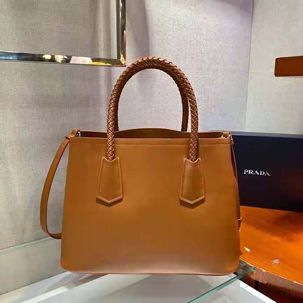Side angle showing silhouette of Prada Women Prada Double Medium Leather Handbag-Brown