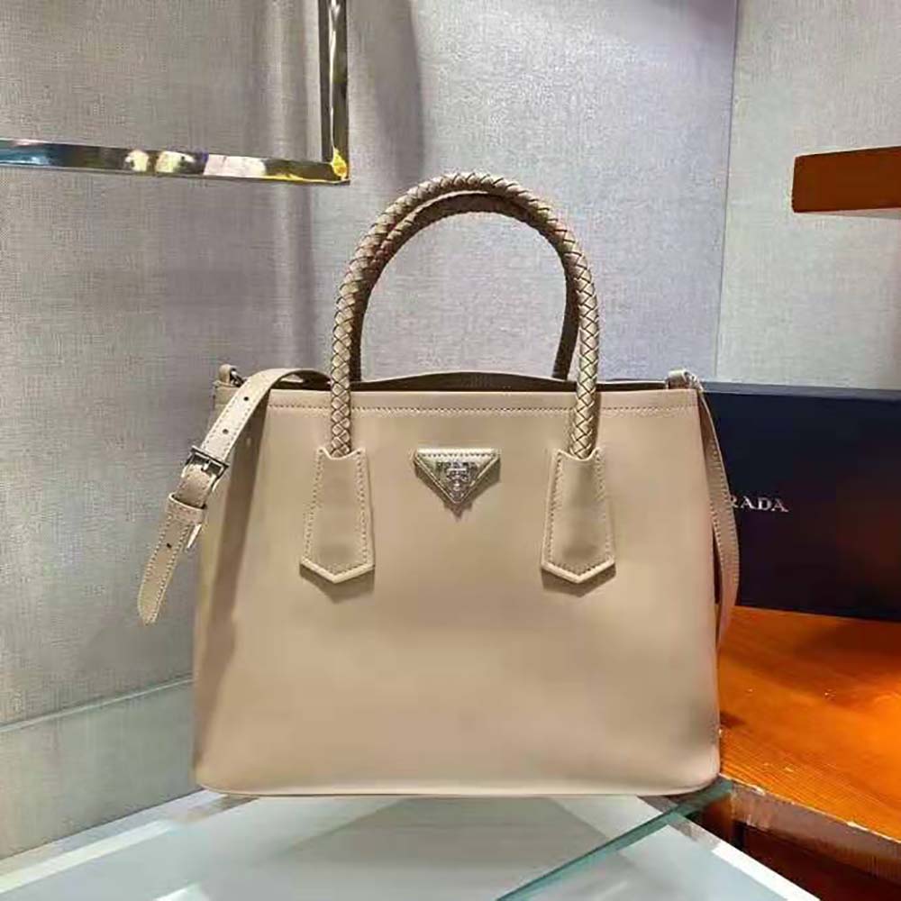 Close-up of gold-tone hardware on Prada Double Medium Leather Handbag-Sandy