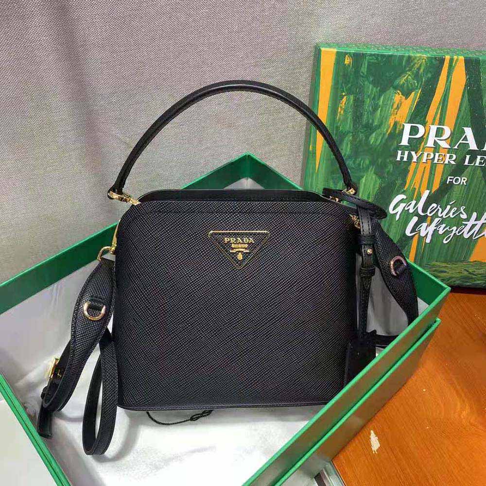 Side angle showing silver-tone closure and strap on Prada Matinee Micro bag