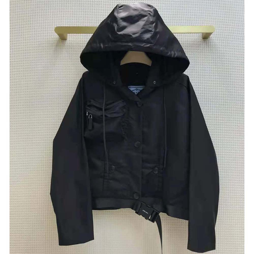 Close-up of zip and Prada logo hardware on the black blouson jacket