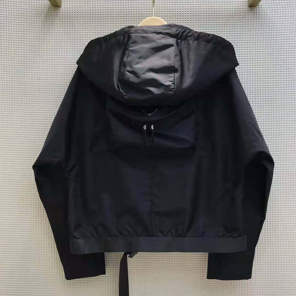 Side profile showing relaxed silhouette of Prada Women Re-Nylon Gabardine Hooded Blouson Jacket-Black