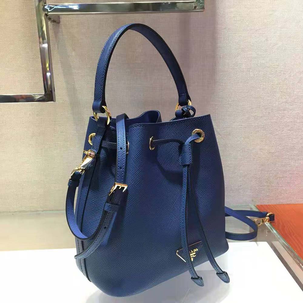 Side angle highlighting textured Saffiano leather of Prada Women Bucket Bag-Navy