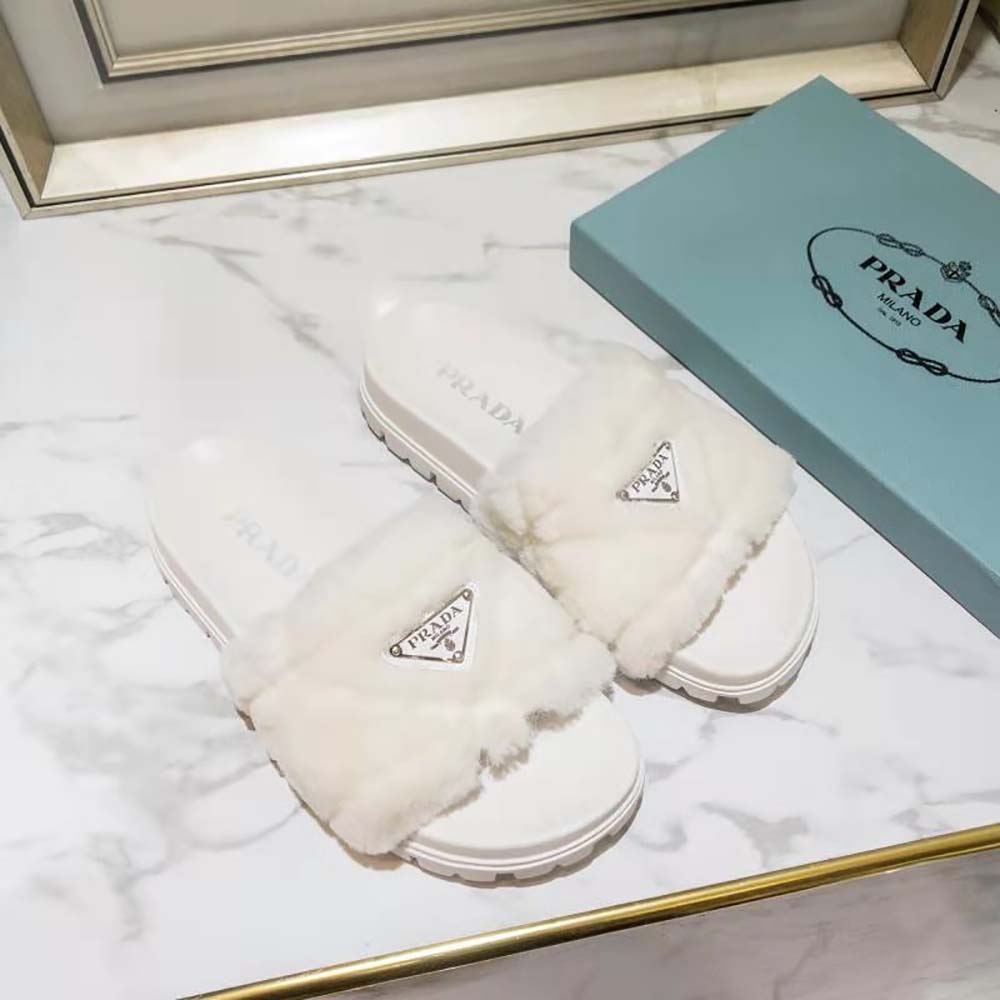 Close-up detail of shearling and white leather on Prada Women Shearling Slides
