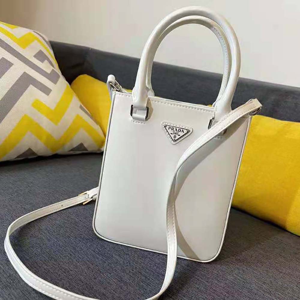 Side angle showing silver hardware on Prada Women Small Brushed Leather Tote