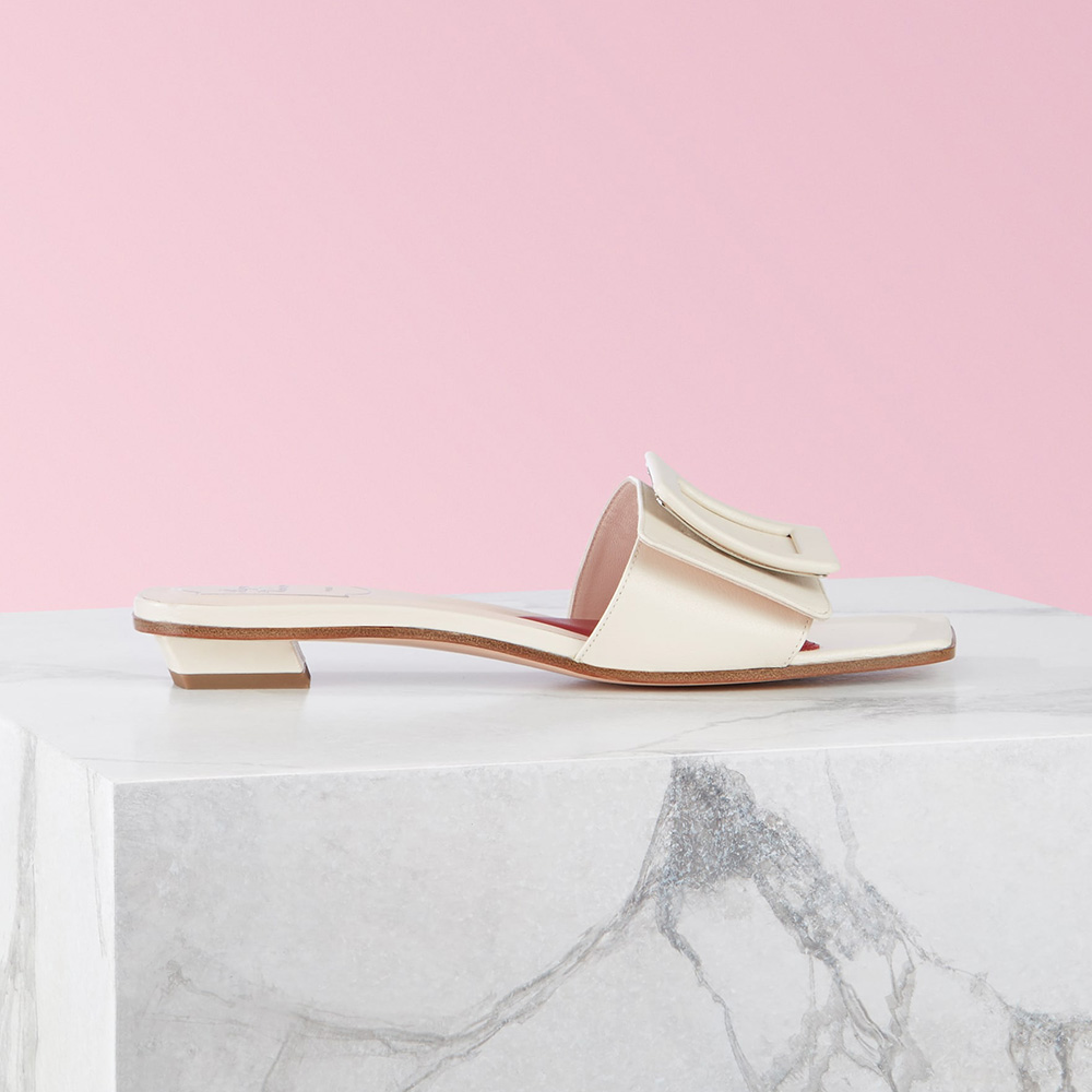 Side view of Roger Vivier Women Covered Buckle Mules in Patent Leather-White