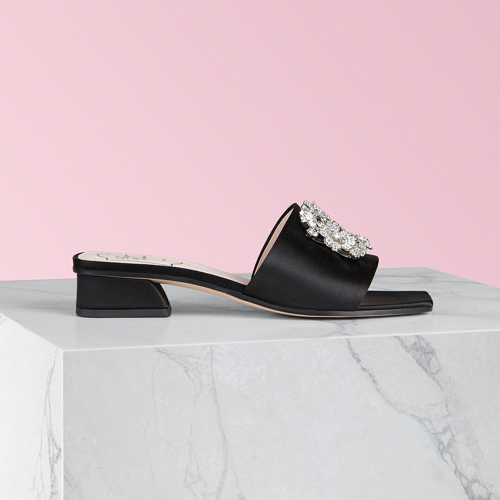 Side view of Roger Vivier RV Bouquet Strass Buckle Mules in black satin