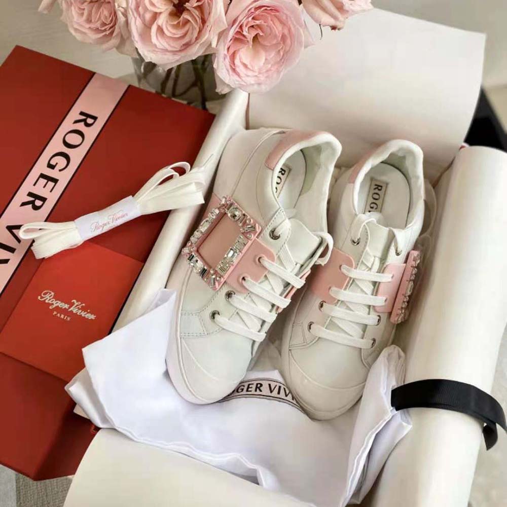 Close-up of sparkling strass buckle on Roger Vivier pink sneakers