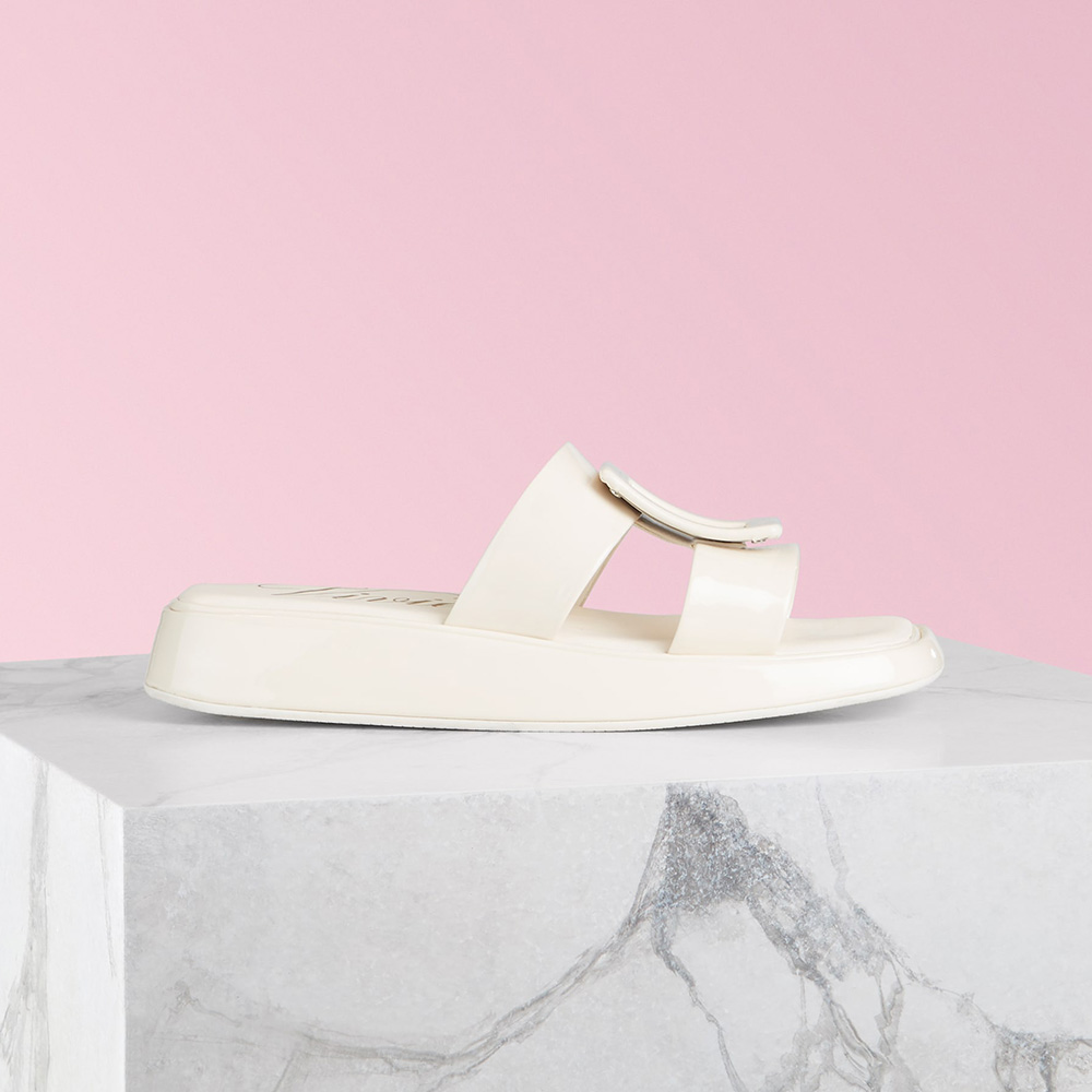 Side view of Roger Vivier Women Vivier Slide Covered Buckle Mules in Patent Leather-White