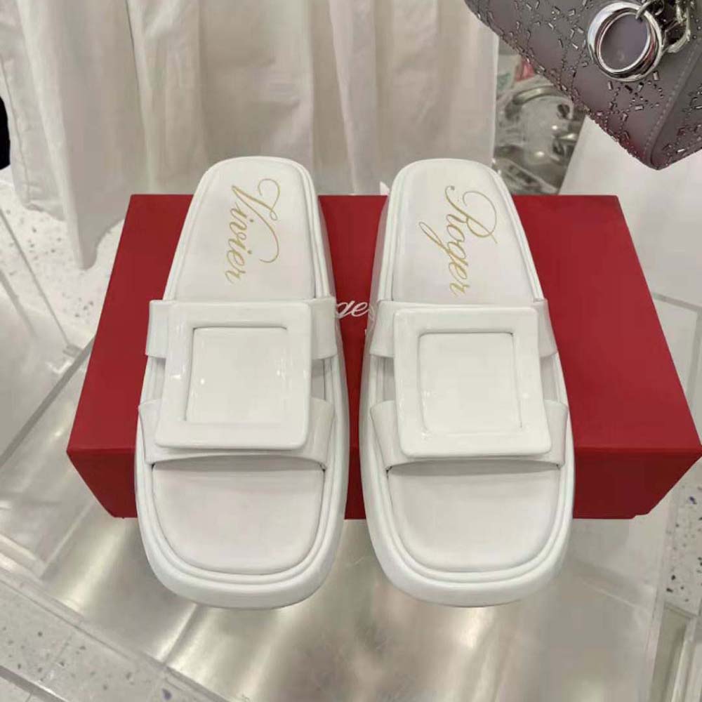 Close-up of signature oversized covered buckle on Roger Vivier mules