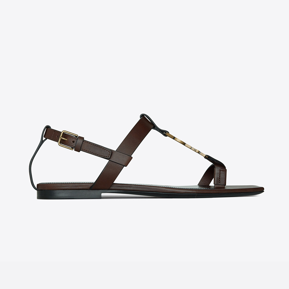 Front angle of Saint Laurent YSL Women Cassandra Flat Sandals in brown leather