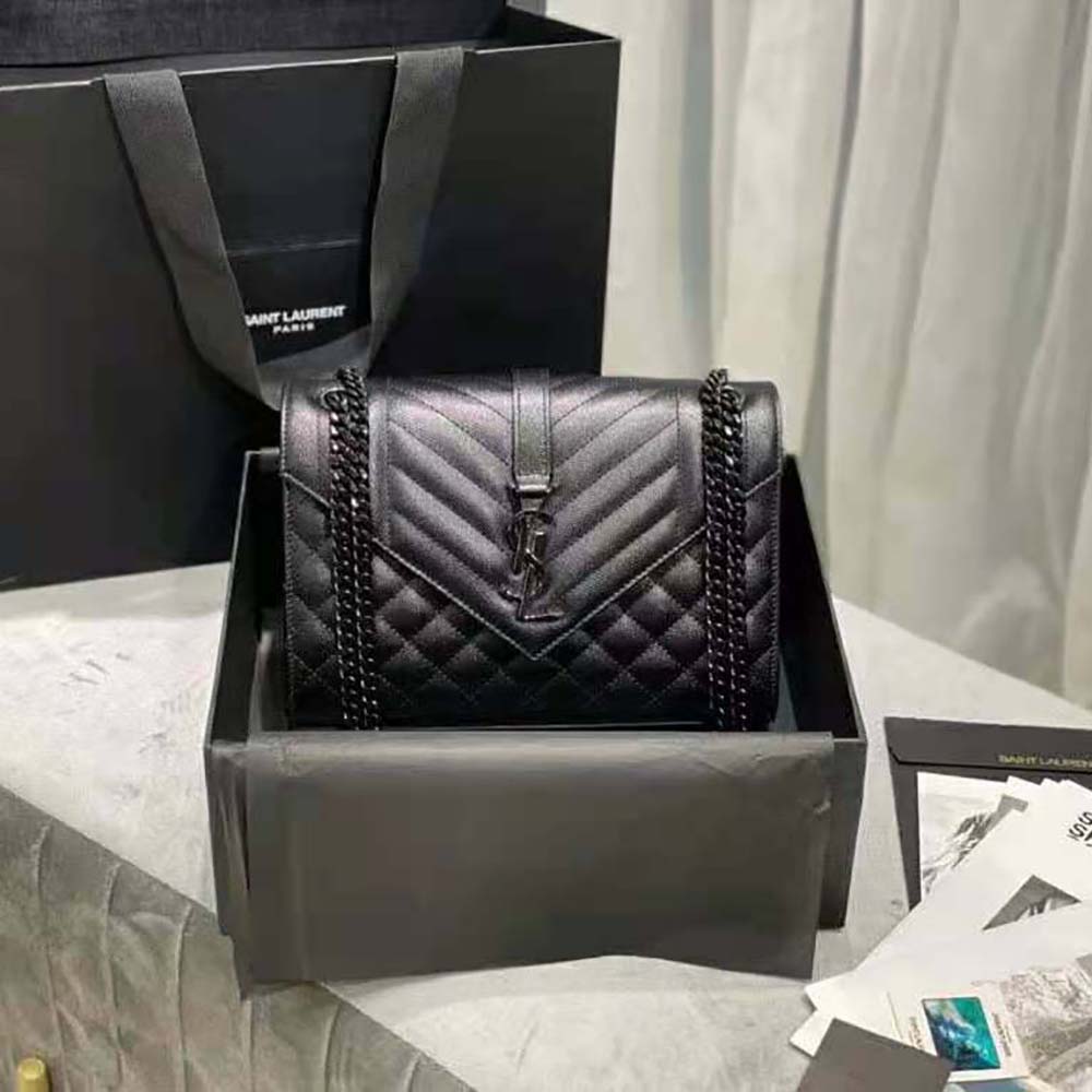 Close-up of gold YSL logo and chain strap on Saint Laurent YSL Medium Bag