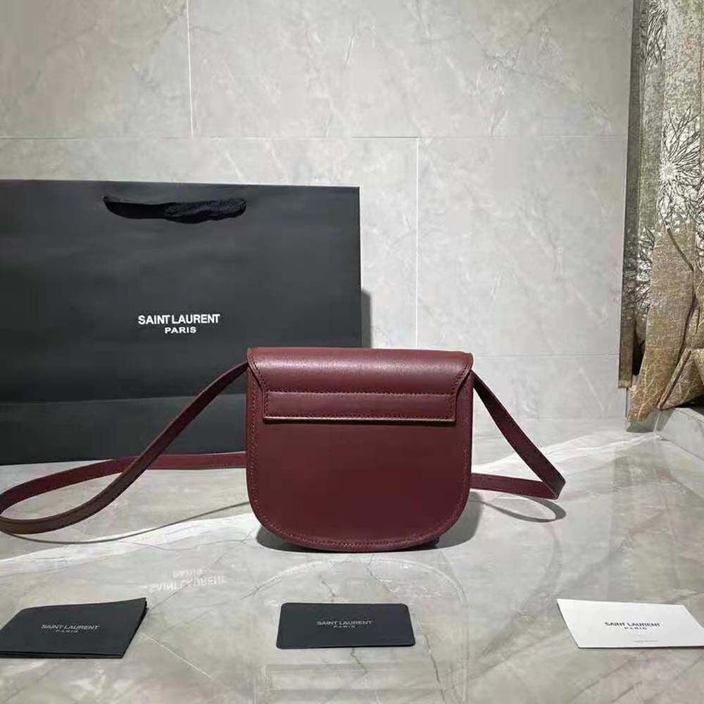 Side profile showing flap closure and shoulder strap of Kaia Small Satchel