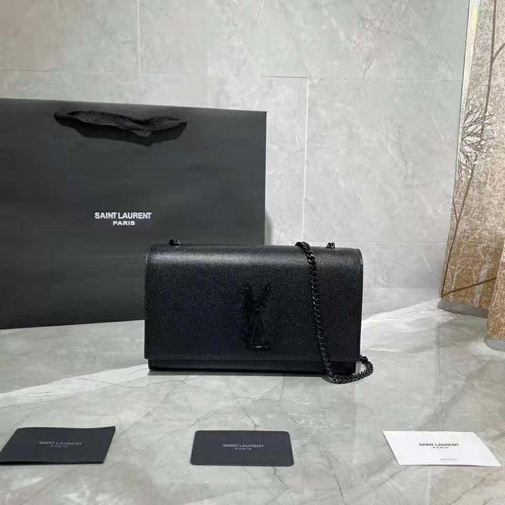 Close-up of gold YSL logo on Kate Medium black shoulder bag