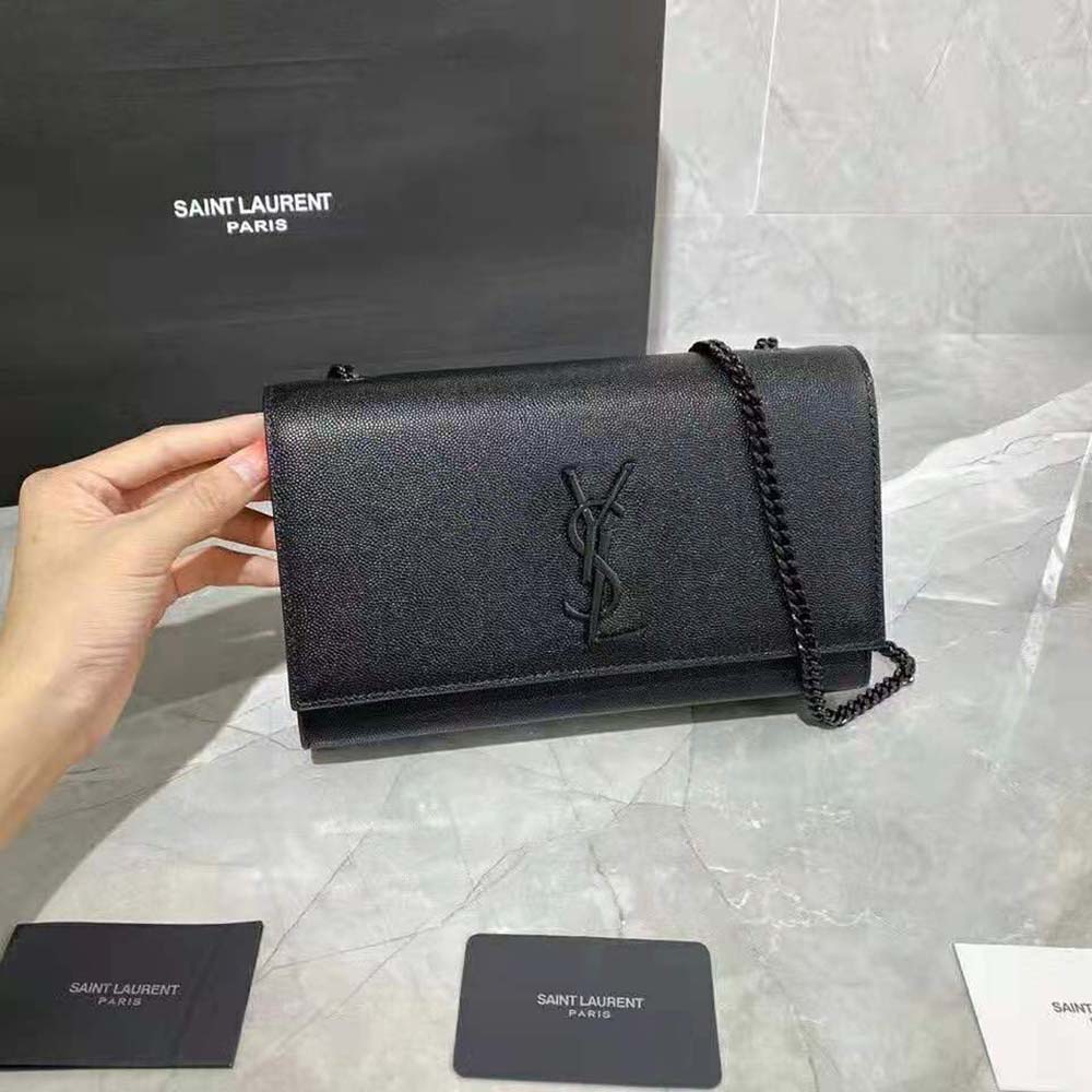 Side profile showing strap and embossed leather texture on Kate Medium