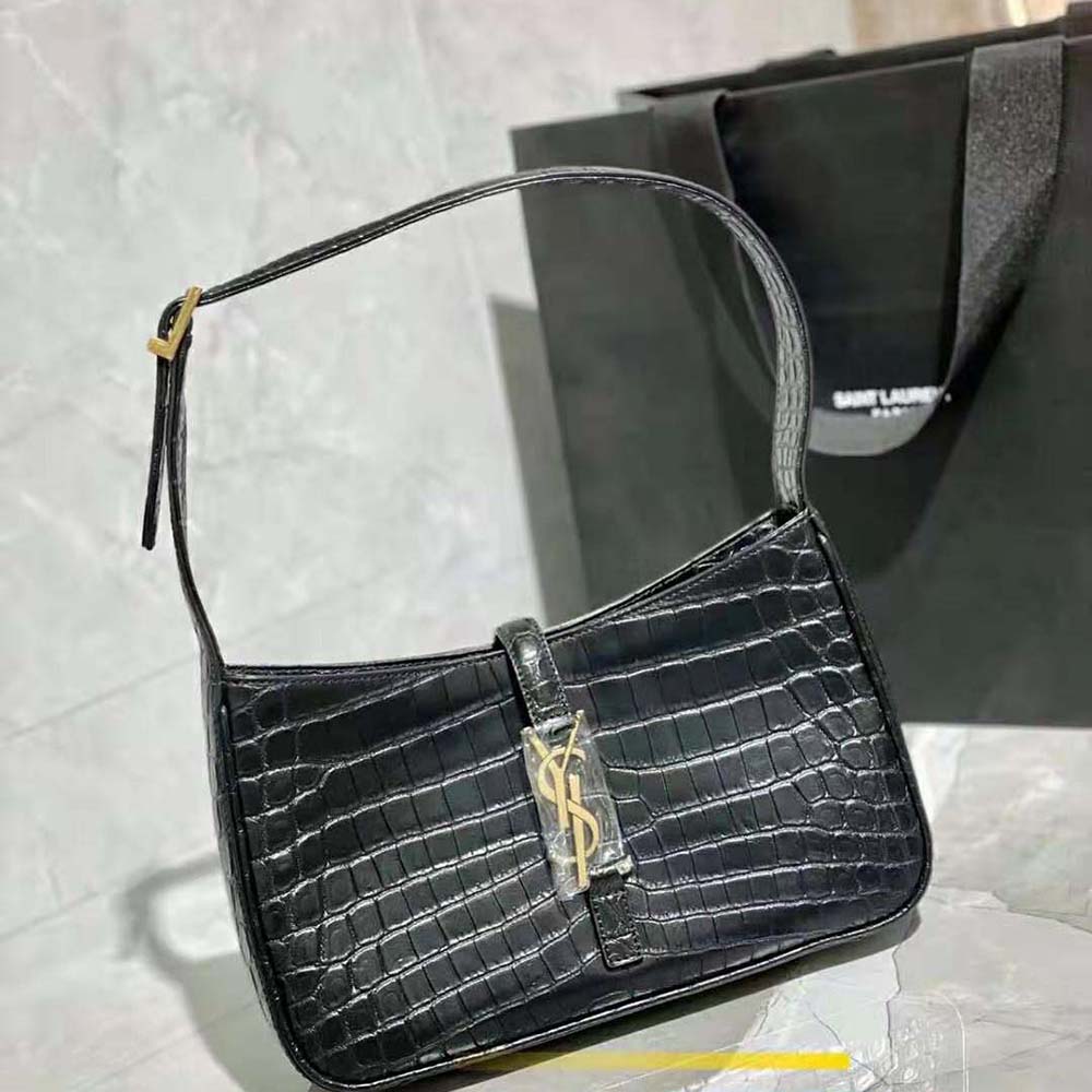 Close-up of gold YSL hardware on Saint Laurent YSL Women LE 5 A 7 Hobo Bag