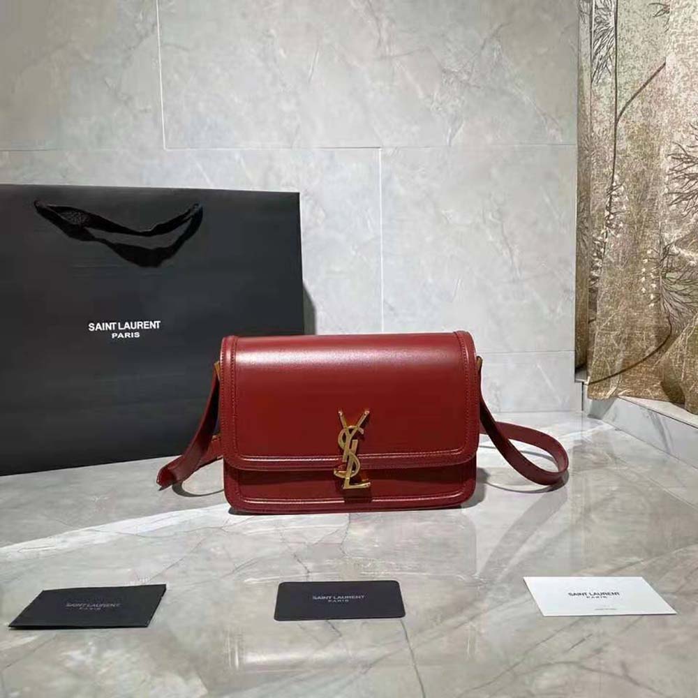 Close-up of gold YSL logo and magnetic flap on Solferino Medium Satchel