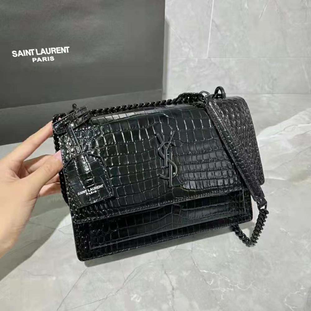 Side profile showing magnetic closure and texture of Saint Laurent YSL Sunset bag