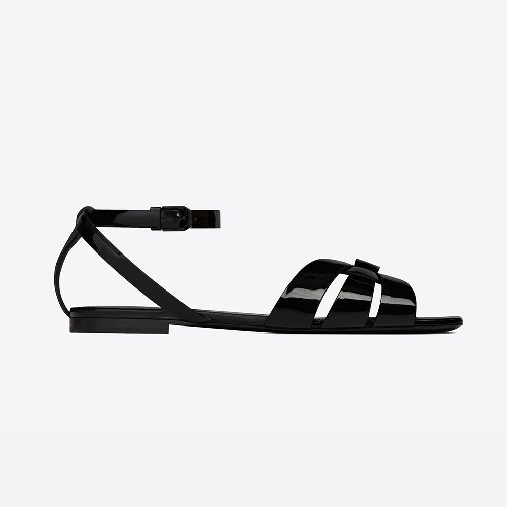 Front angle of Saint Laurent YSL Women Tribute Flat Sandals in black patent leather
