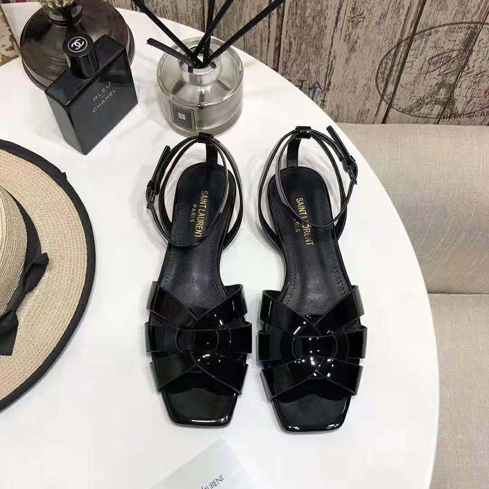Close-up of gold YSL logo hardware on Saint Laurent YSL Women Tribute Flat Sandals
