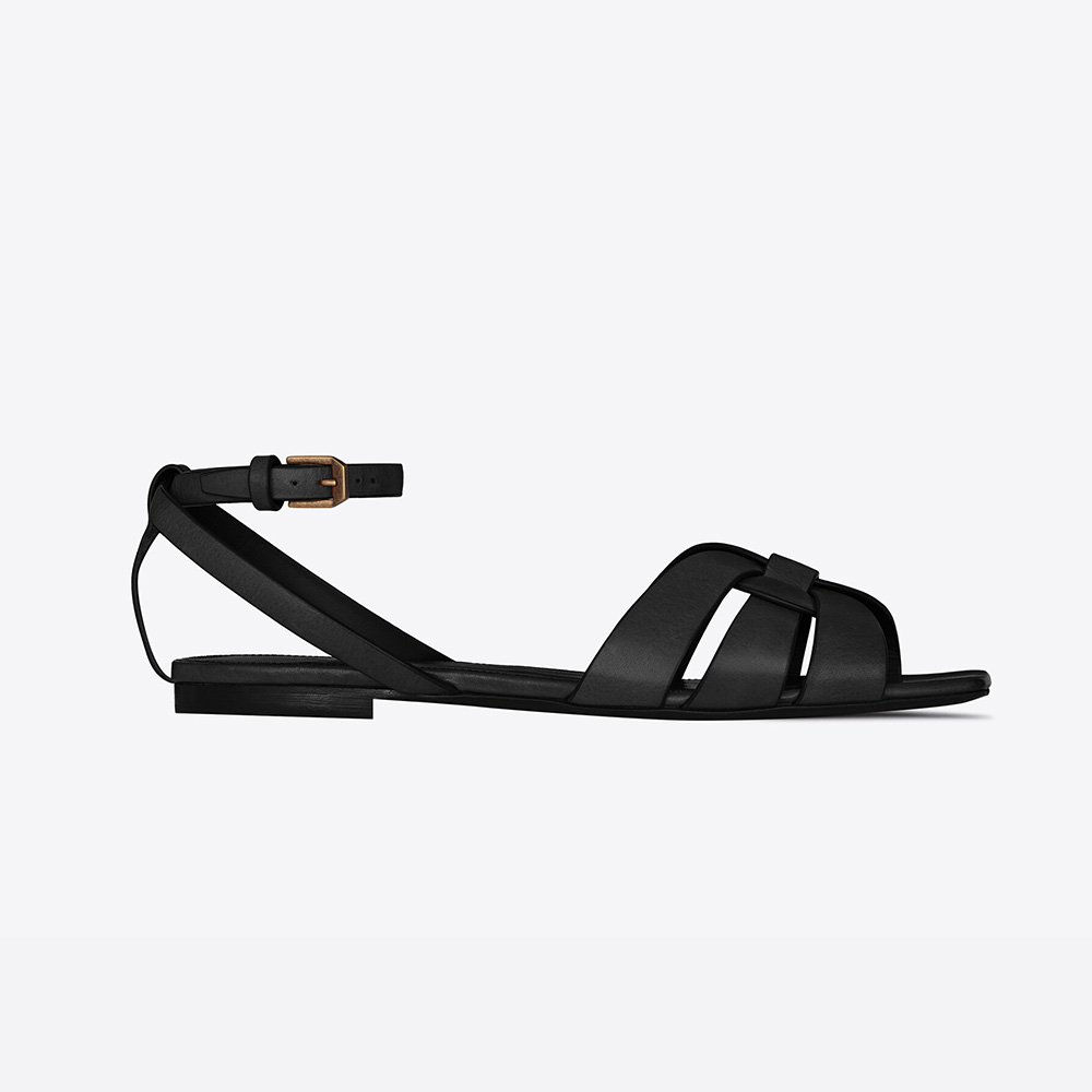Side view of Saint Laurent YSL Women Tribute Flat Sandals in black leather