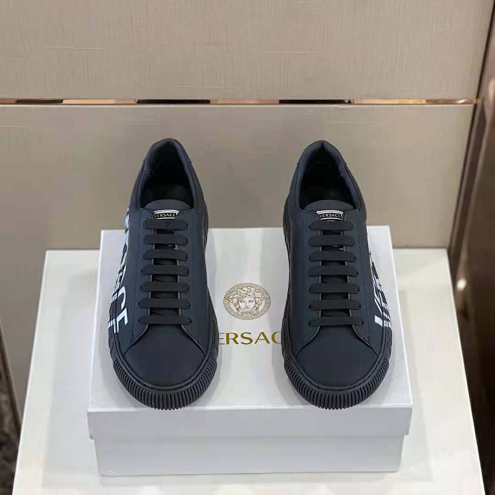 Close-up of embossed Greca logo on Versace Unisex Shoes Greca Logo Sneakers-Black