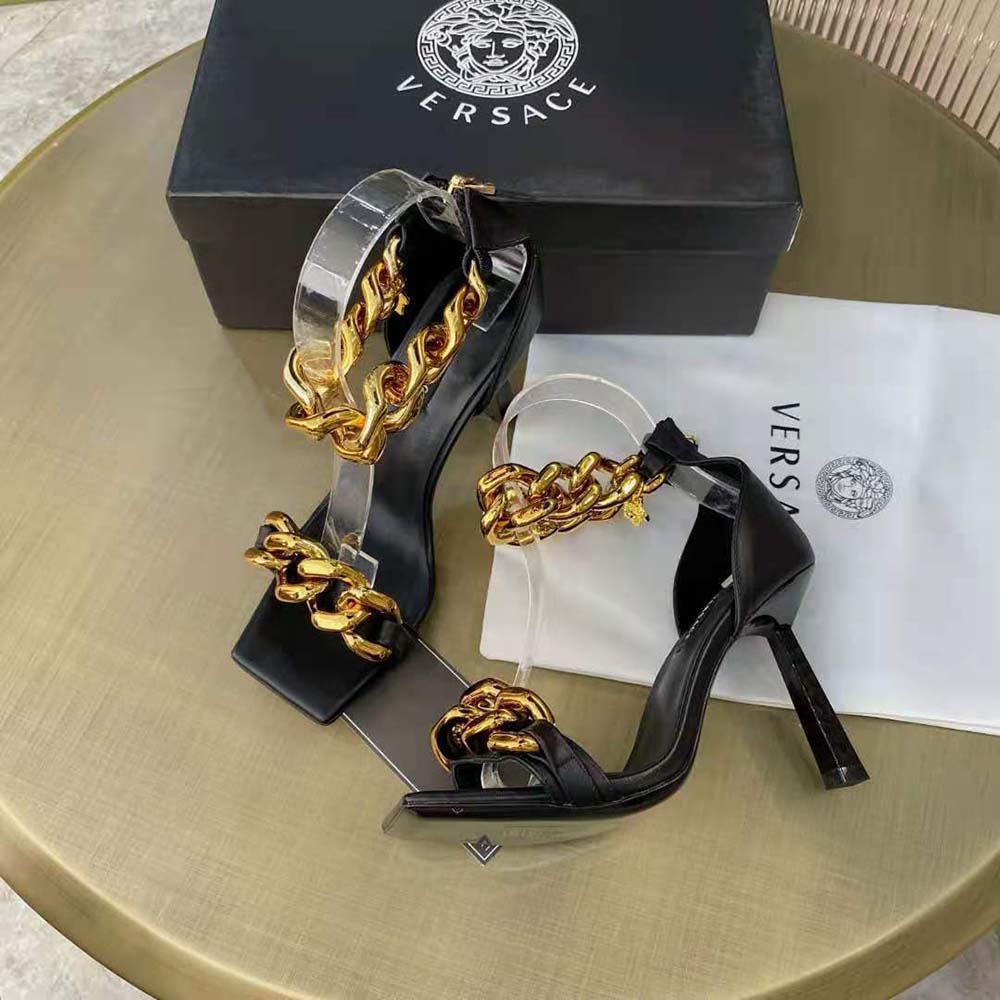 Close-up detail of gold Medusa chain on Versace Women Nappa Leather Sandals