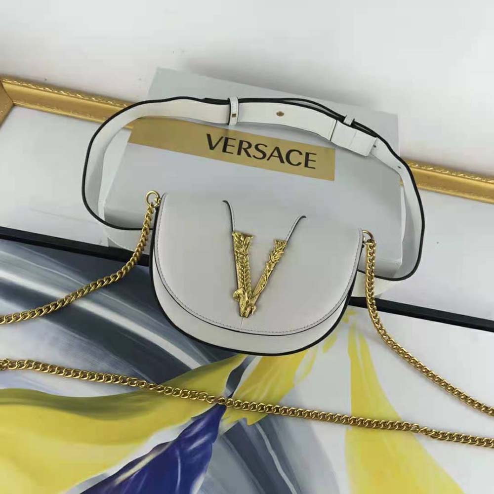 Close-up of gold Medusa hardware on Versace Women Virtus Belt Bag
