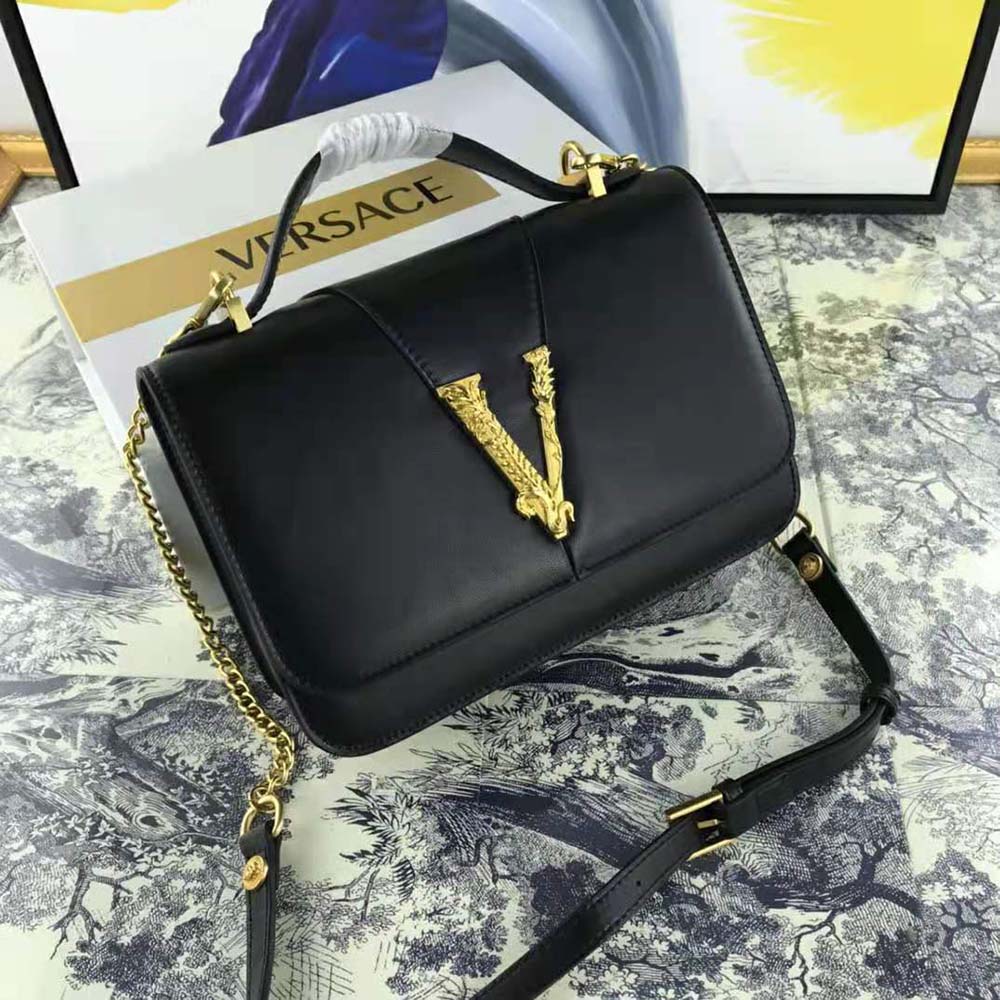 Close-up of gold Medusa clasp on Versace Women Virtus Shoulder Bag