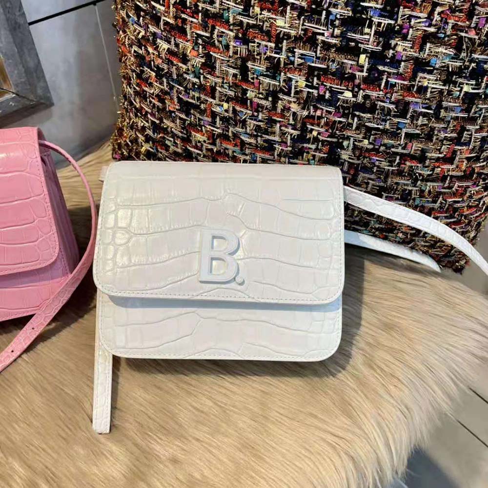 Close-up of silver hardware on Balenciaga Women B. Small Bag white embossed leather