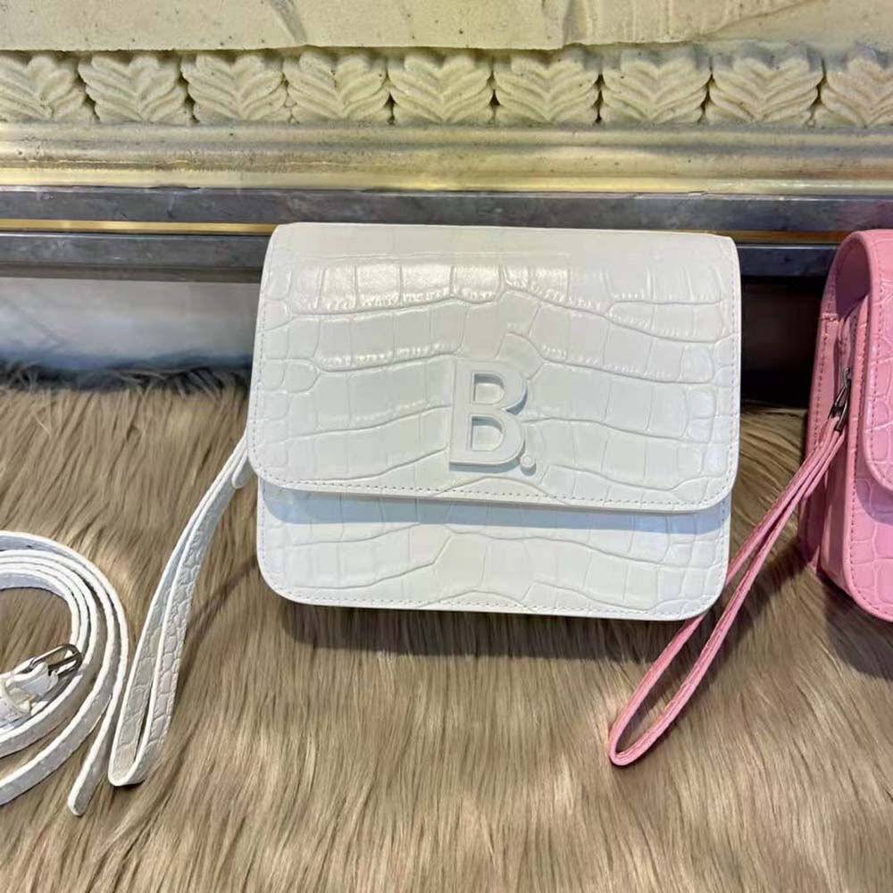 Side profile showing slim silhouette of Balenciaga Women B. Small Bag white calfskin
