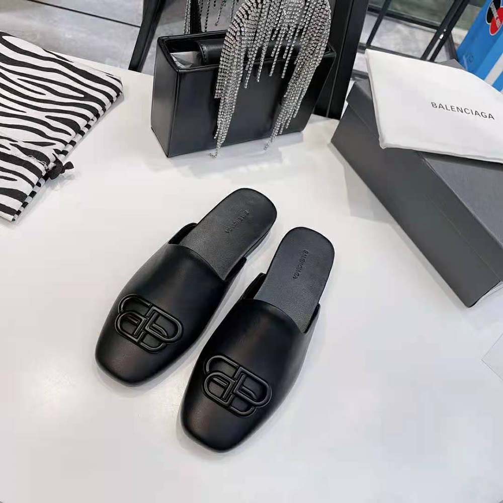 Close-up of matte BB hardware detail on Balenciaga Cosy BB Slide