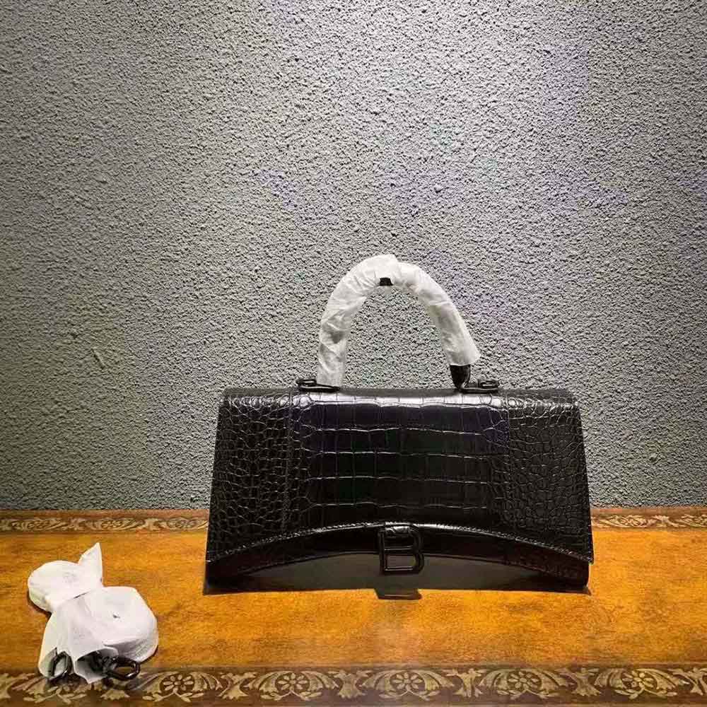 Close-up of gold hardware and crocodile embossing on Balenciaga Women Hourglass Stretched Top Handle Bag