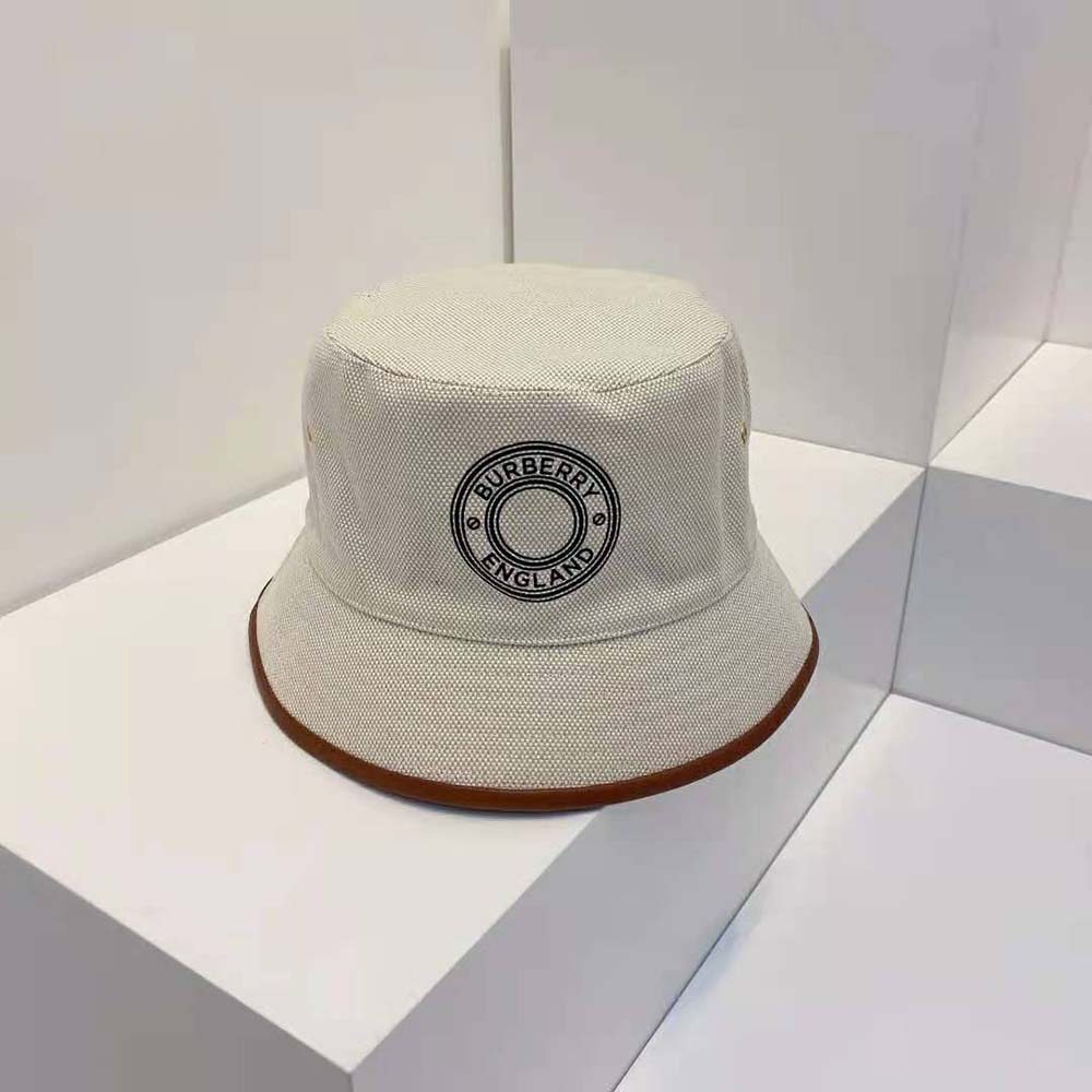Close-up of leather trim and Burberry logo on beige bucket hat
