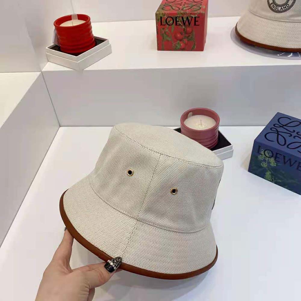 Side angle showing silhouette of Burberry Women Leather Trim Logo Graphic Canvas Bucket Hat