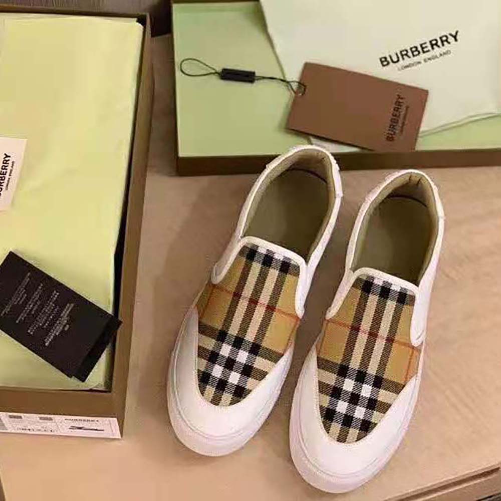 Close-up showing vintage check detail on Burberry slip-on sneakers