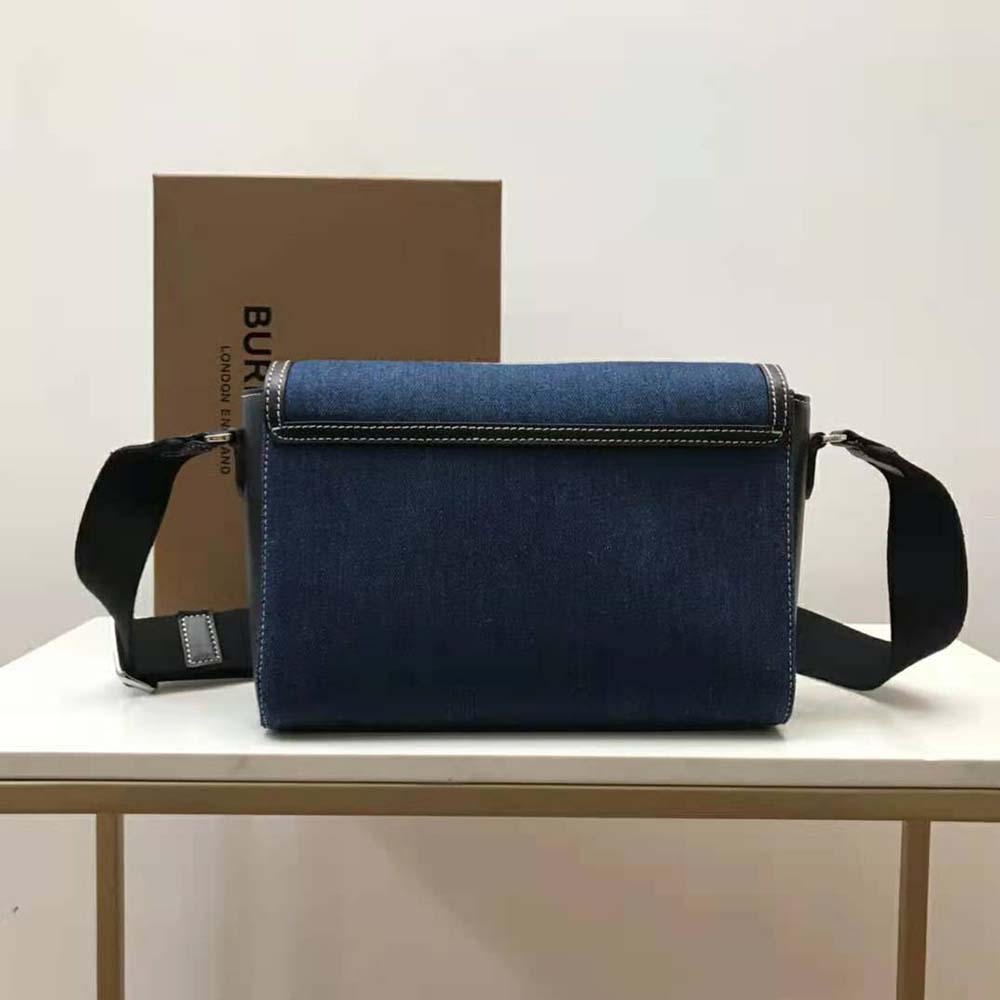 Side profile showing adjustable strap on Burberry denim crossbody bag