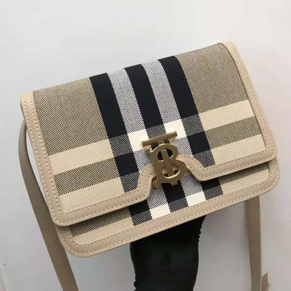 Side angle showing beige leather trim and canvas pattern on Burberry Women Medium Check Canvas and Leather TB Bag-Beige