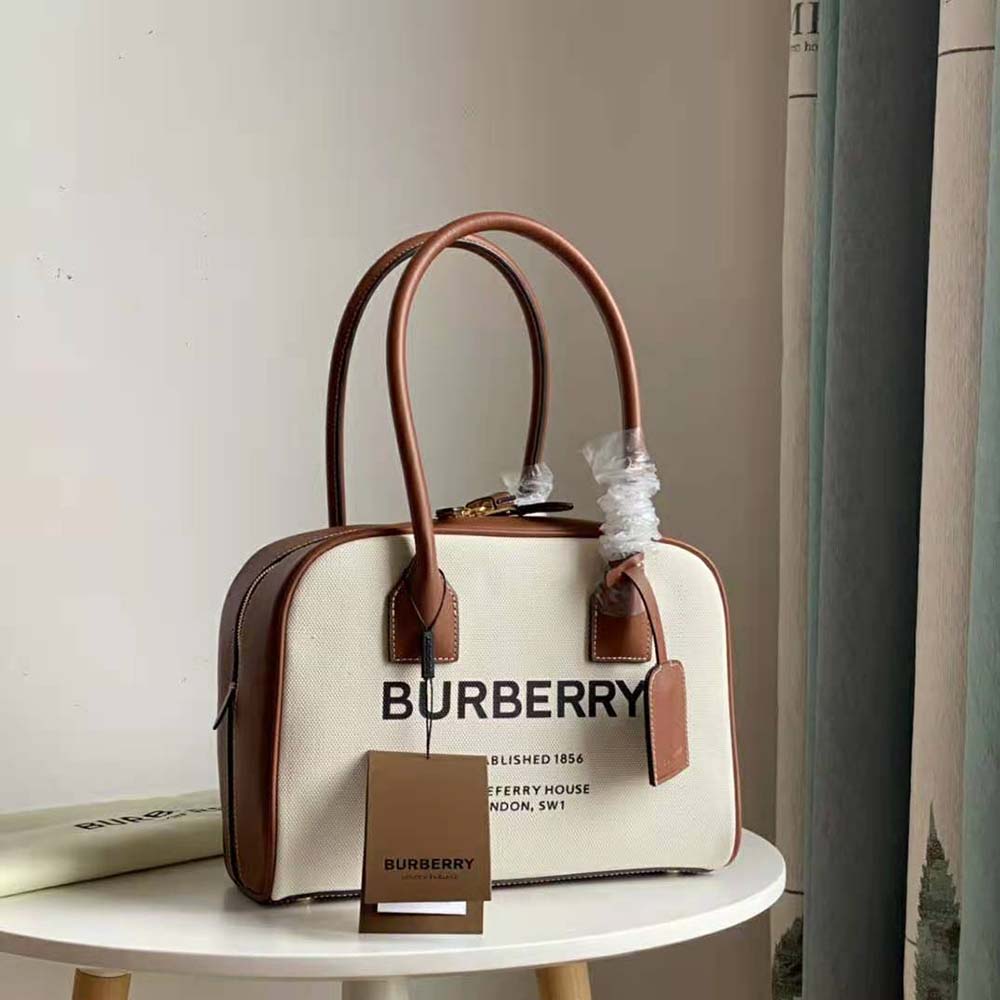 Side angle showing silhouette and Horseferry print on Burberry Women Medium Horseferry Print Cotton Canvas Half Cube Bag-Brown