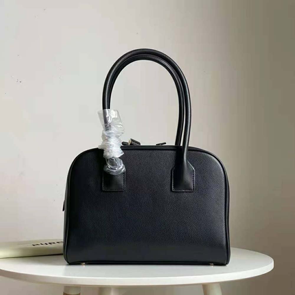 Side view showing structured silhouette of Burberry Women Medium Leather Half Cube Bag-Black