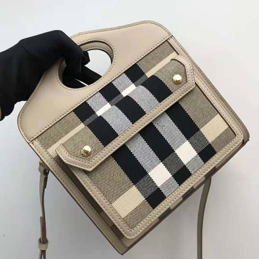 Side angle showing gold hardware and zip closure on Burberry pocket bag