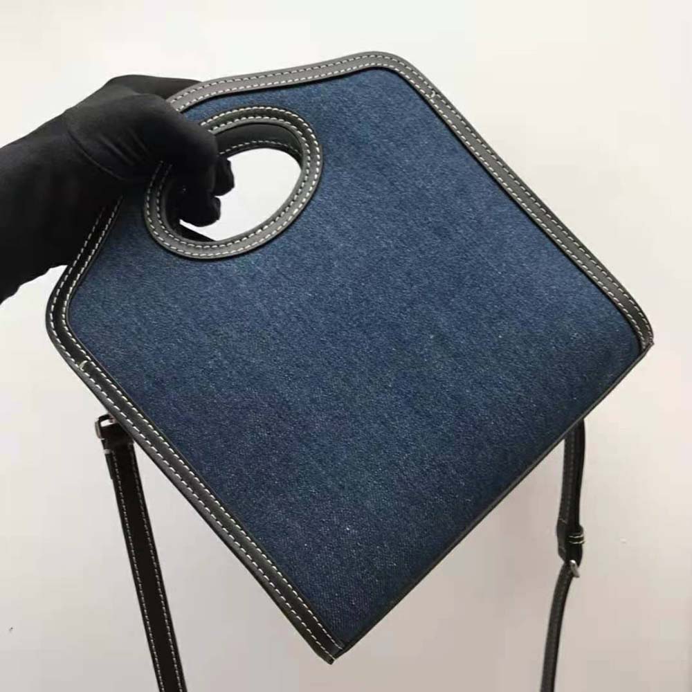 Side angle showing denim texture and leather trim on Burberry pocket bag