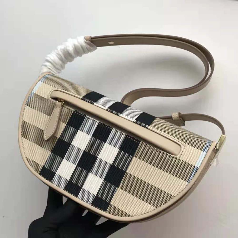 Side view showing compact silhouette of Burberry Women Olympia Bag