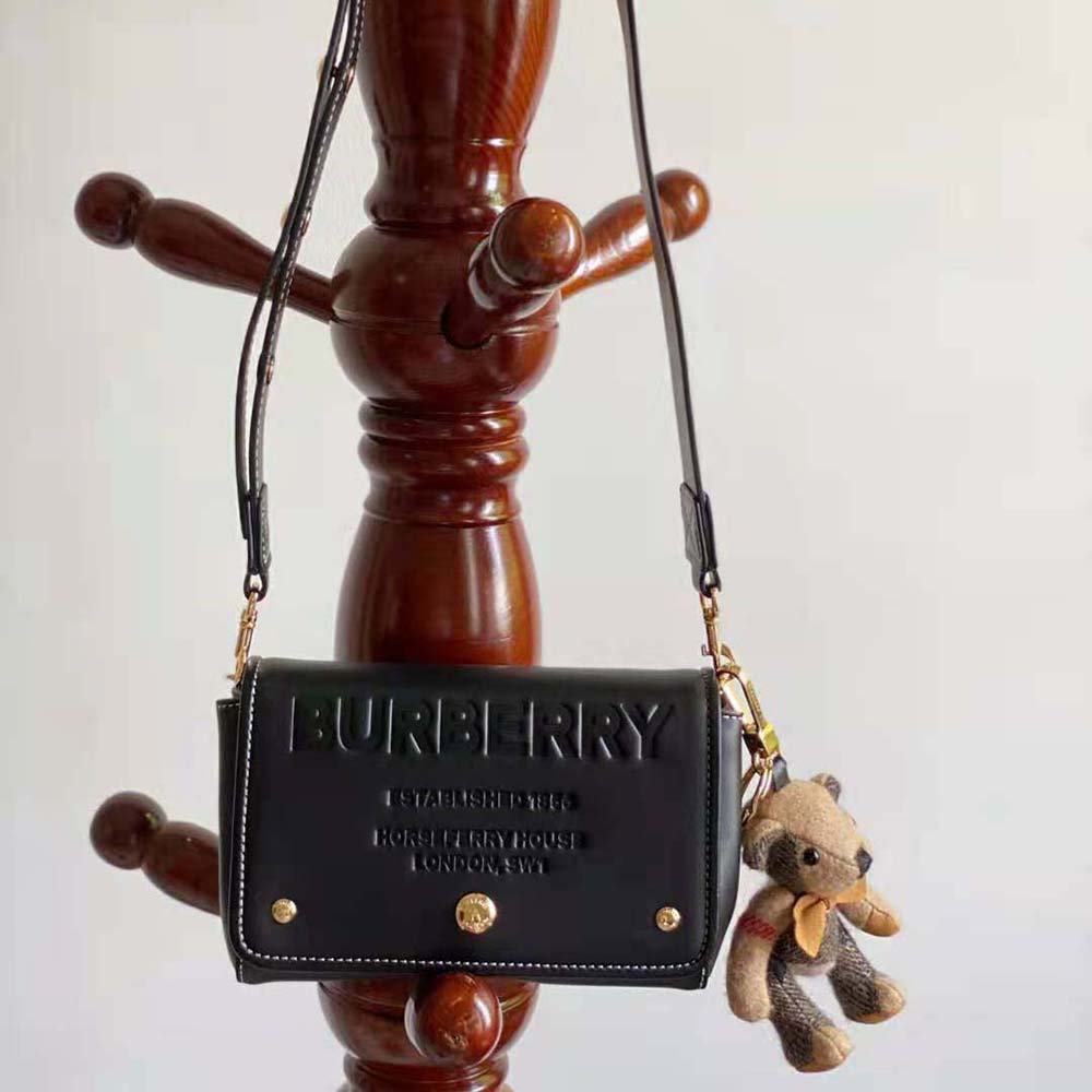 Close-up of gold hardware on Burberry Women Small Horseferry Leather Crossbody Bag-Black