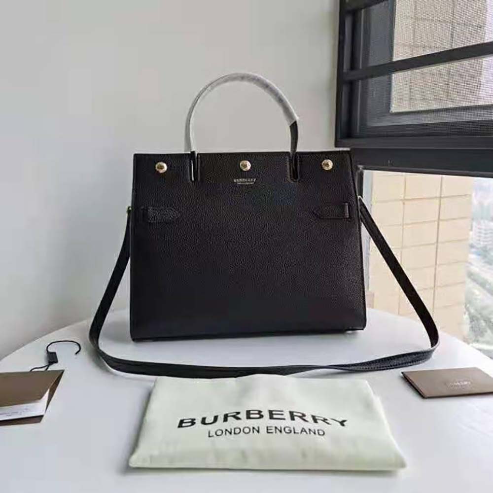 Close-up of gold-tone hardware on Burberry Women Small Leather Title Bag-Black