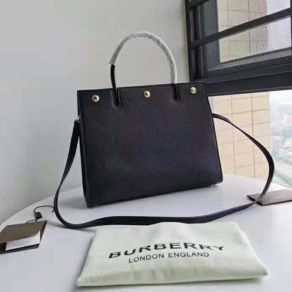 Side angle showing smooth leather texture of Burberry Women Small Leather Title Bag-Black