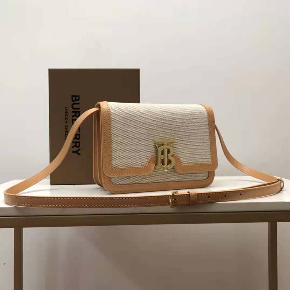 Close-up of gold TB hardware on Burberry Yellow shoulder bag