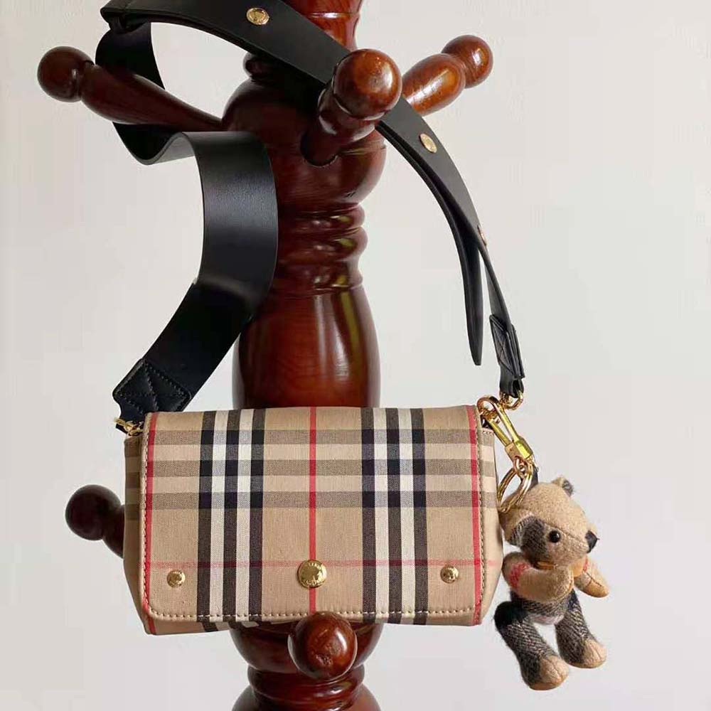 Side angle showing gold-tone hardware on Burberry Women Small Vintage Check crossbody