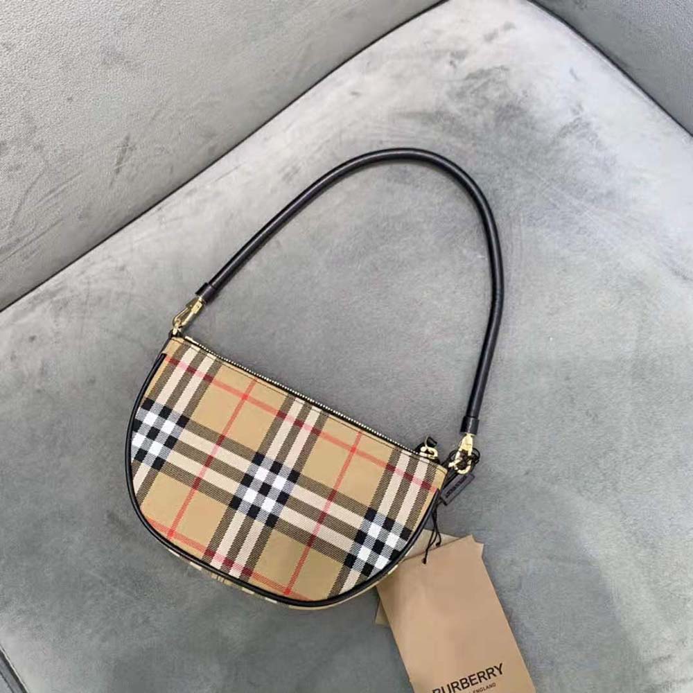 Side angle showing slim profile of Burberry Women Vintage Check Cotton Olympia Pouch-Brown