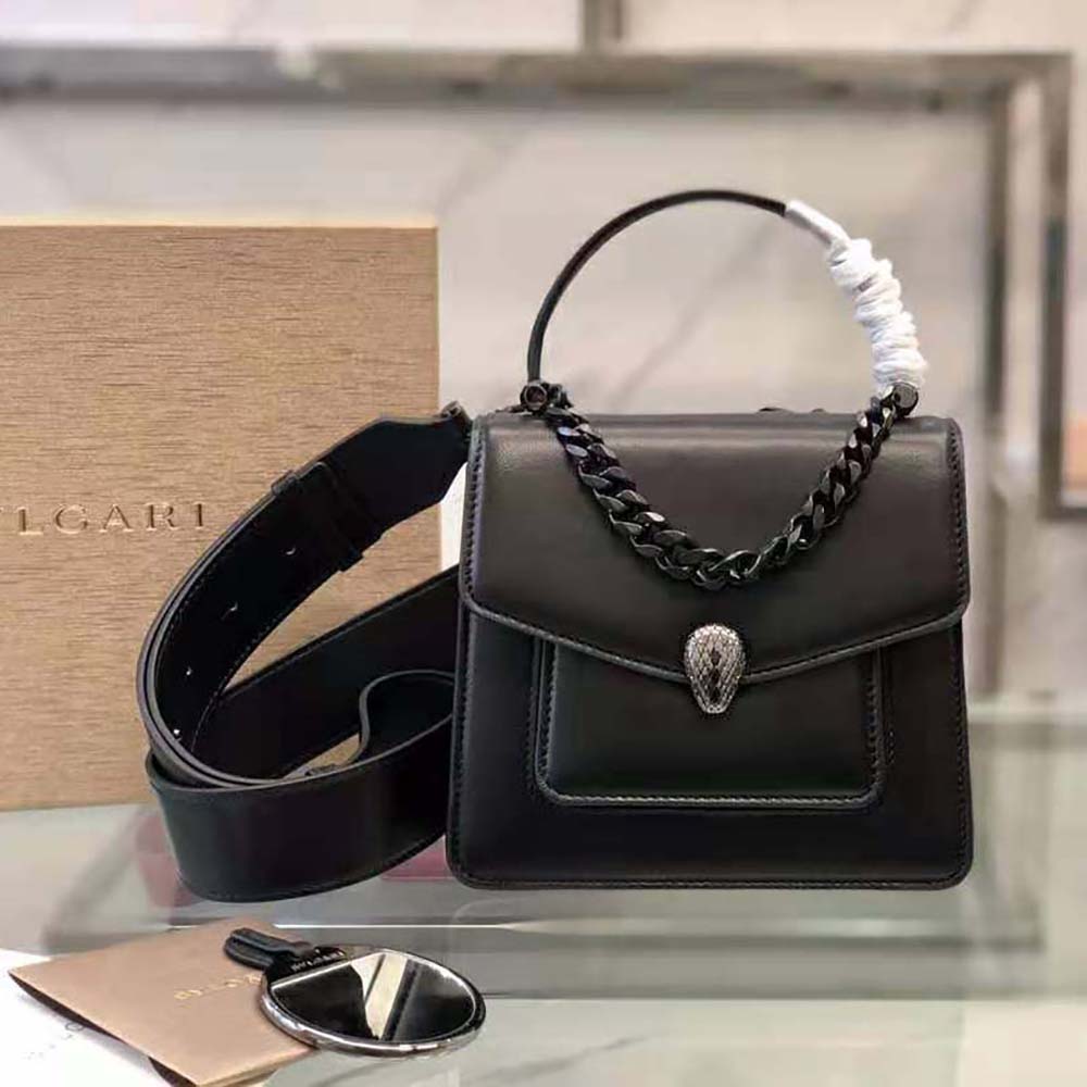 Close-up of gold-tone Serpenti scale closure on Bvlgari Women Serpenti Forever bag