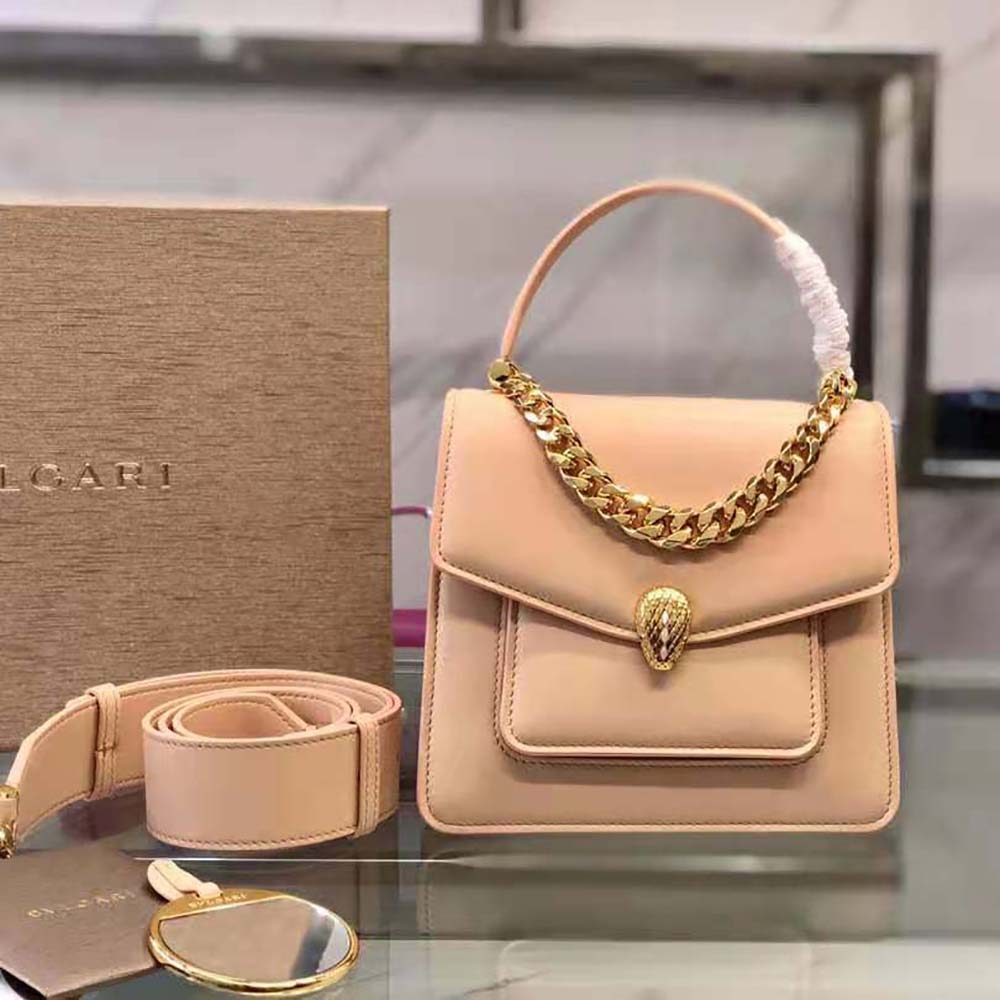 Close-up of signature snakehead clasp on Bvlgari Serpenti Forever bag